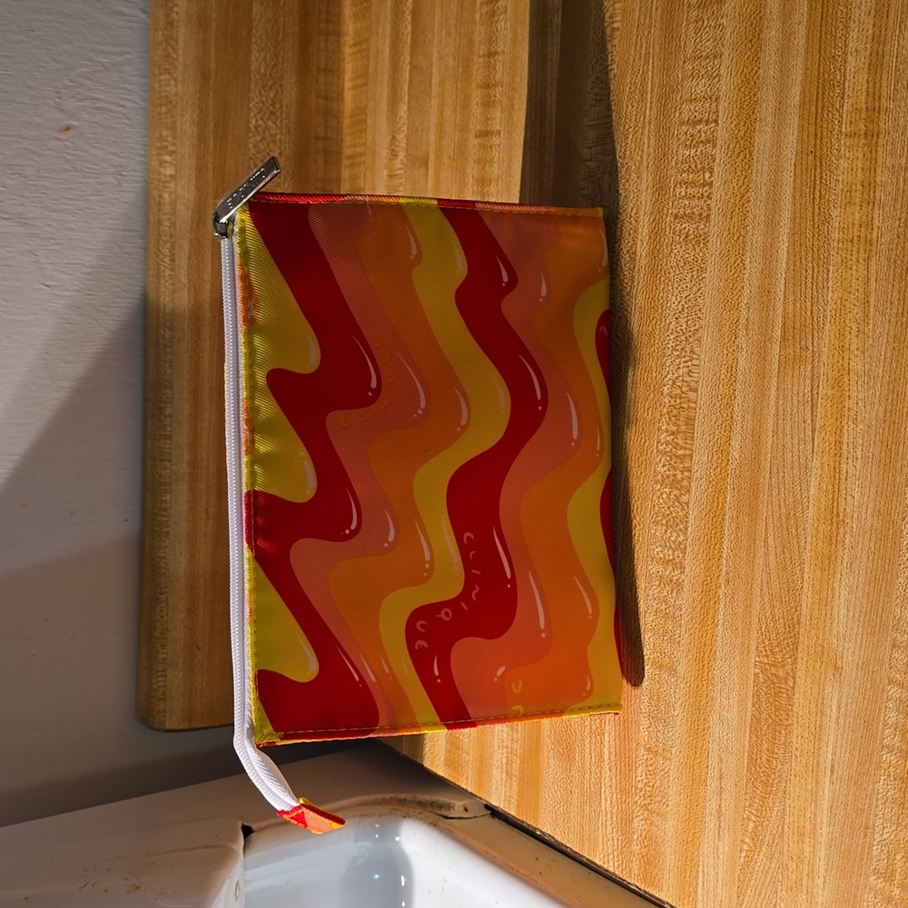 Clinique Cosmetic Makeup Pouch NWOT Red Orange Yellow Wave Pattern
